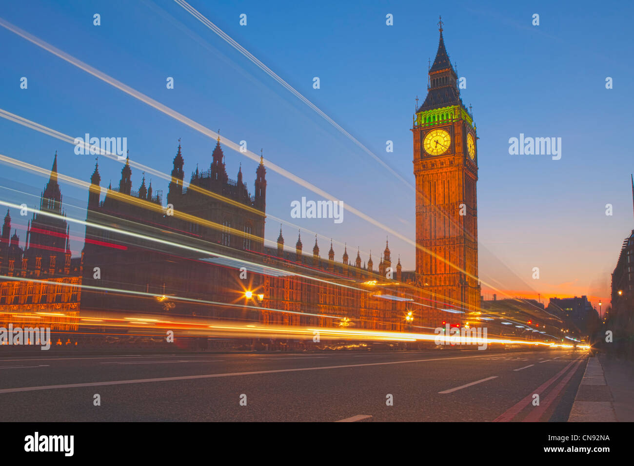 Traffic blur in front of Big Ben and Parliament at twilight Stock Photo