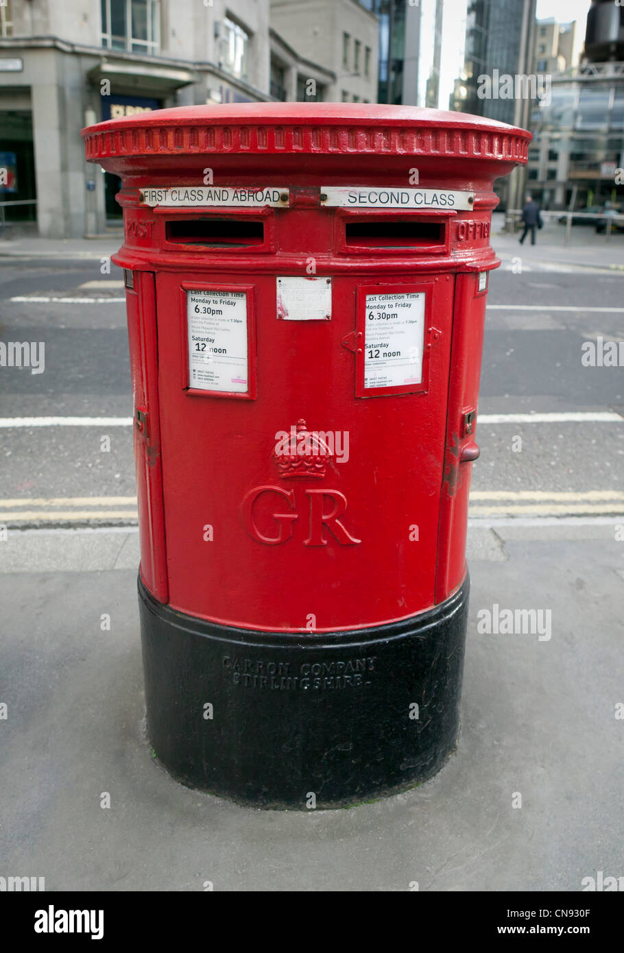 Red Royal Mailbox on street of London Stock Photo
