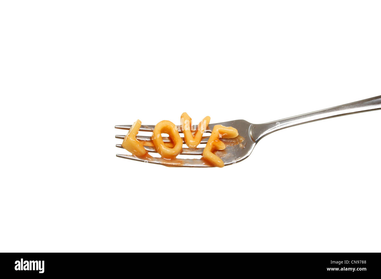 Alphabet spaghetti on a fork spells love isolated against white Stock Photo