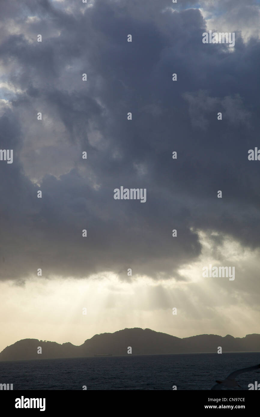 Sun rays through dark clouds hi-res stock photography and images - Alamy