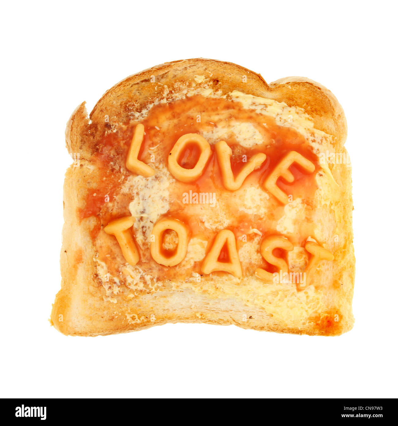 Alphabet spaghetti on buttered toast spells love toast isolated against white Stock Photo