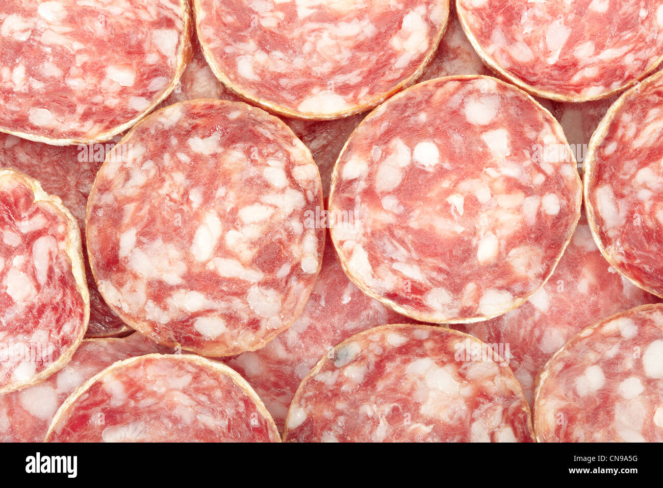 Salami slices texture background Stock Photo Alamy