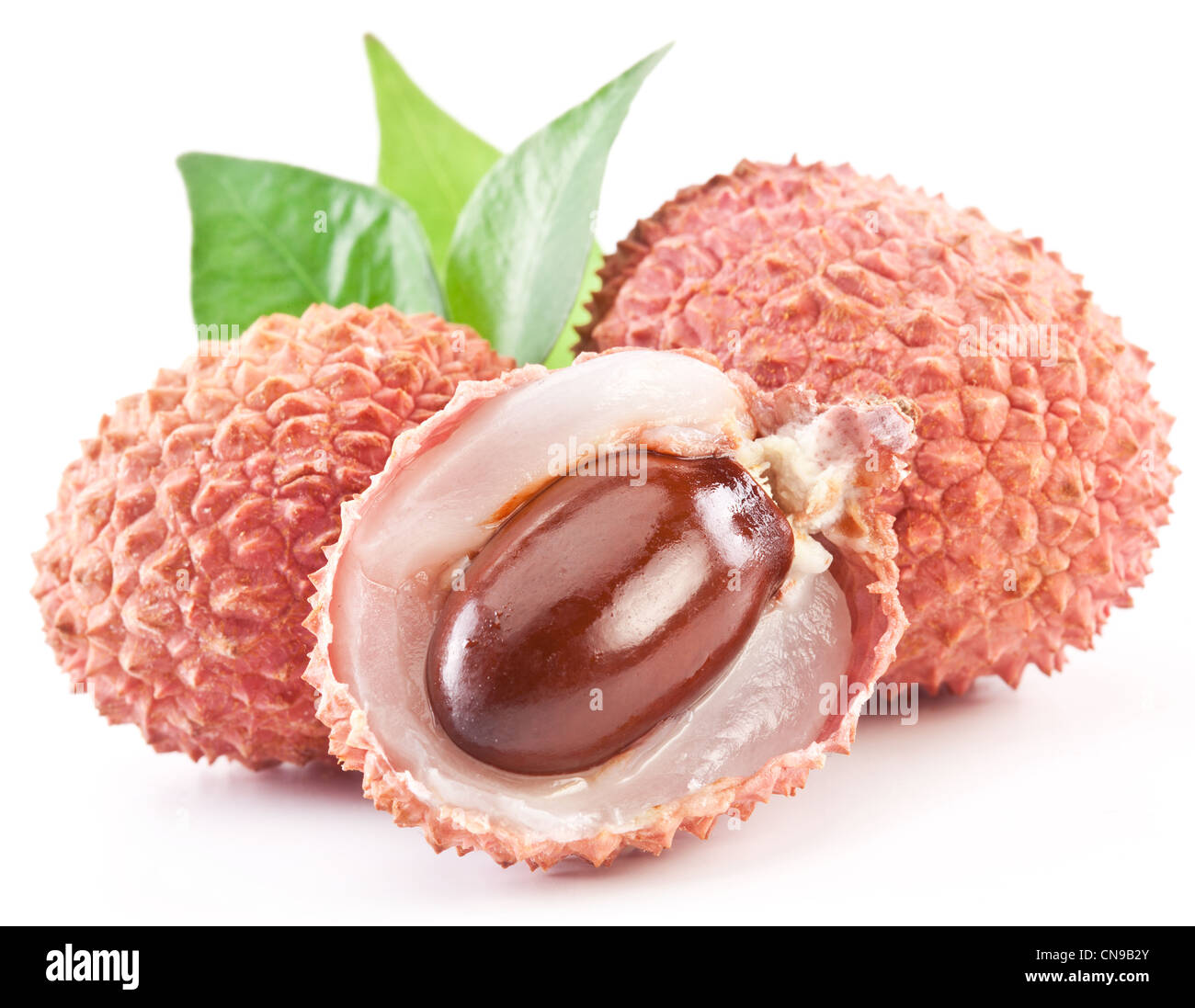 Lychee with leaves on a white background. Stock Photo