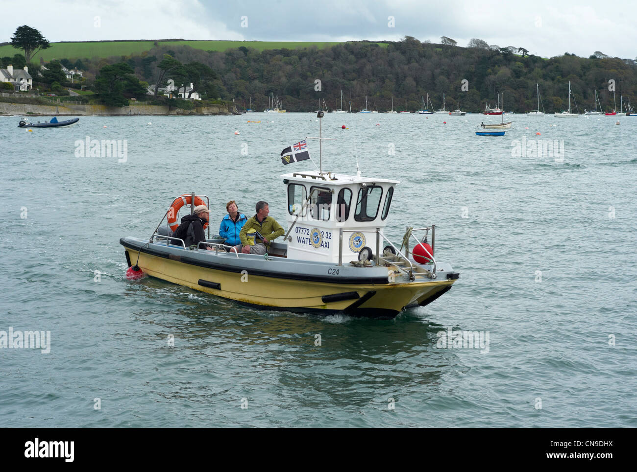 St Mawes to St Anthony passenger ferry and water taxi with Roseland Peninsular behind Stock Photo