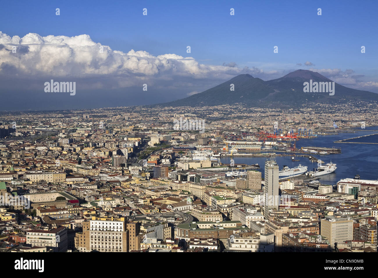 Italy, Campania, Naples, view over the Historic center (listed as World Heritage by UNESCO), Mount Vesuvius and the harbour Stock Photo