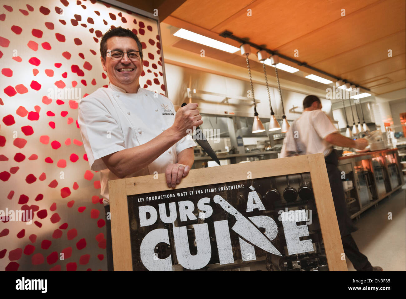 Canada, Quebec Province, Montreal, Normand Laprise of Toque ! with the poster of the film Turistas, documentary film that Stock Photo