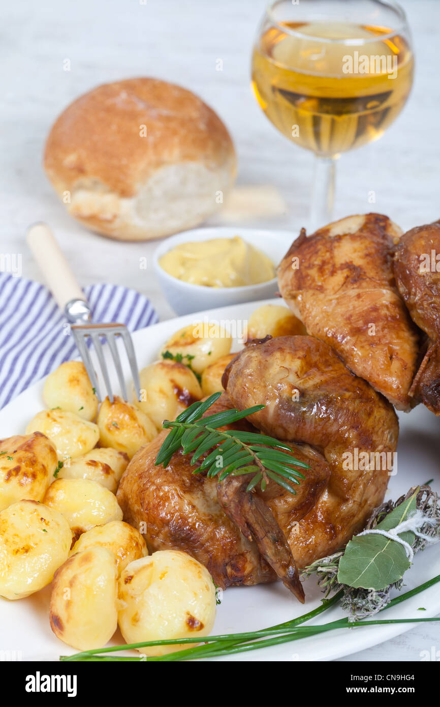 Tasty chicken with roasted potatoes Stock Photo - Alamy