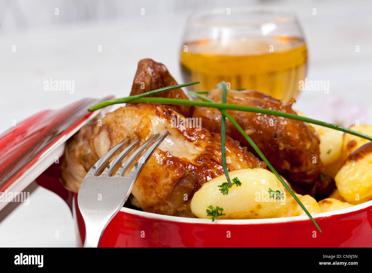 Tasty chicken with roasted potatoes Stock Photo - Alamy