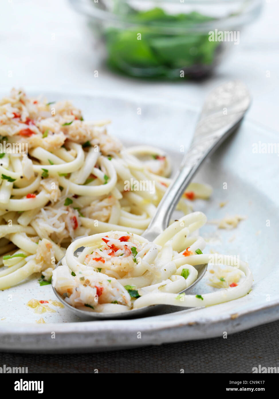 Spoonful of crab and chili spaghetti Stock Photo Alamy