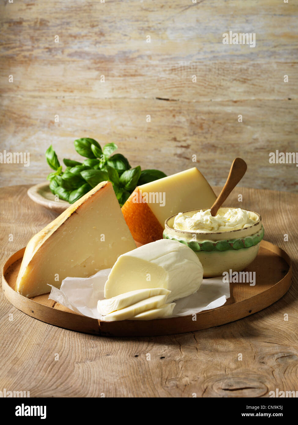 https://c8.alamy.com/comp/CN9K5J/italian-cheeses-on-wooden-board-CN9K5J.jpg