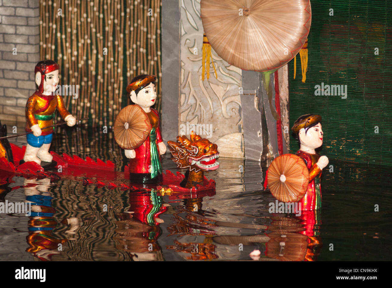 Water puppets riding in a dragon boat, Thang Long Water Puppet Theatre, Hanoi, Vietnam Stock Photo