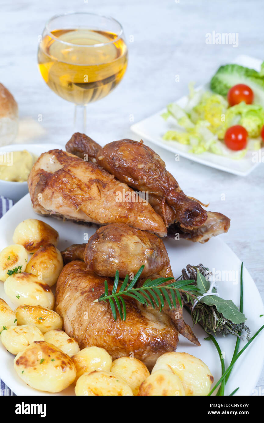 Tasty chicken with roasted potatoes Stock Photo - Alamy