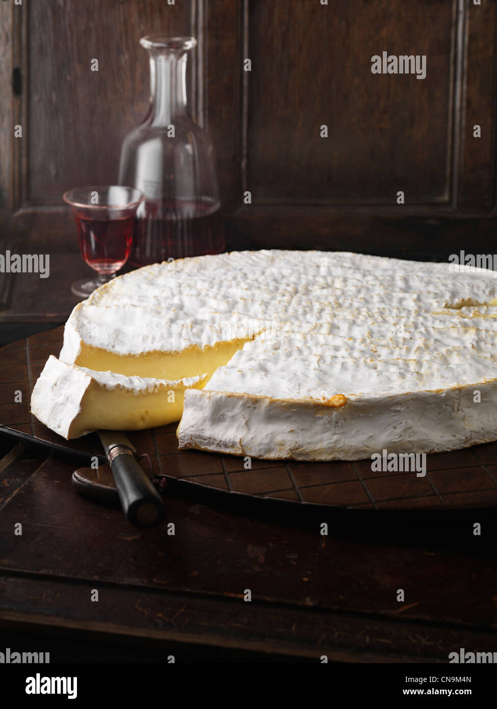 Wheel of Brie on wooden board Stock Photo