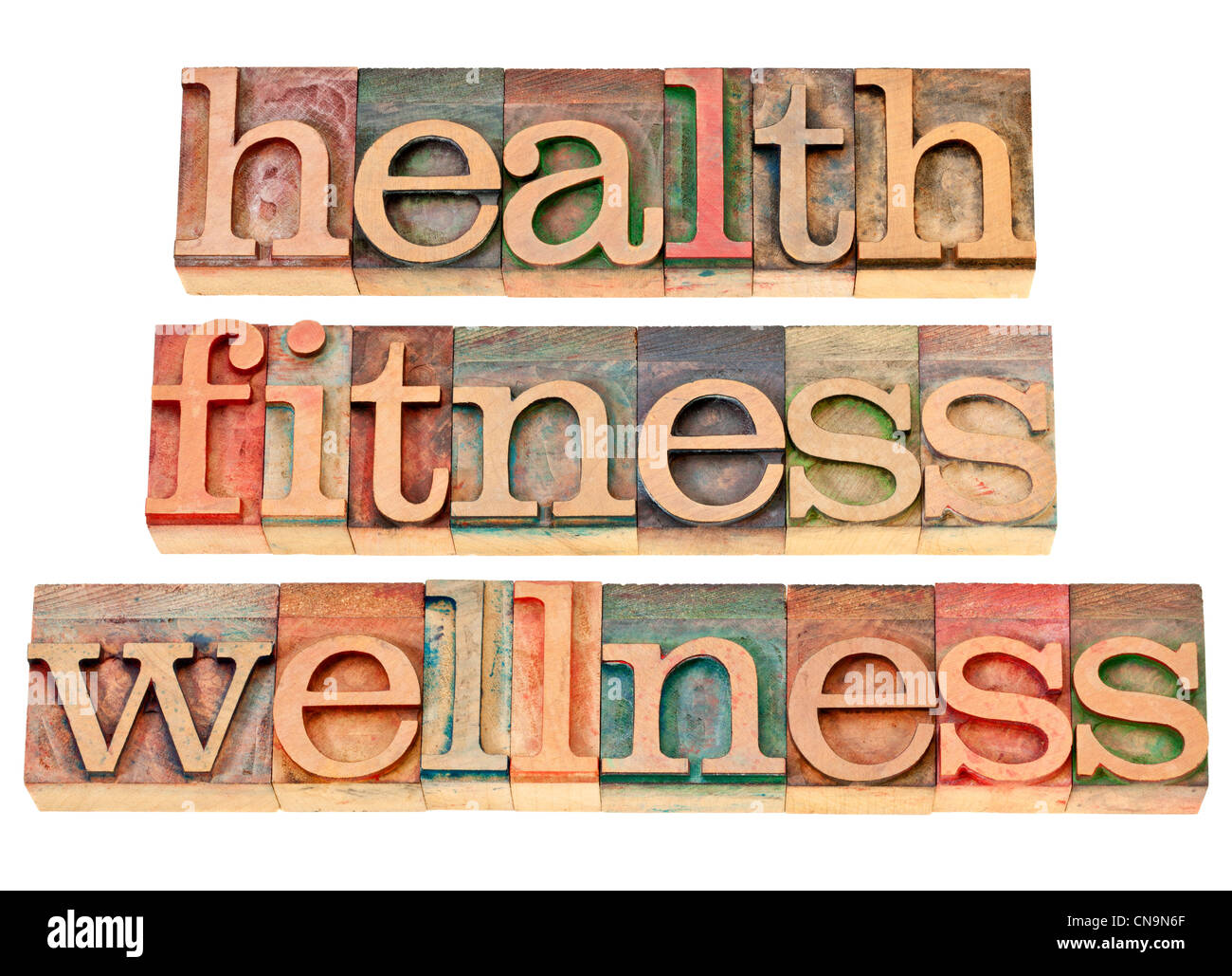 health, fitness, wellness - healthy lifestyle concept - isolated text in vintage letterpress wood type Stock Photo