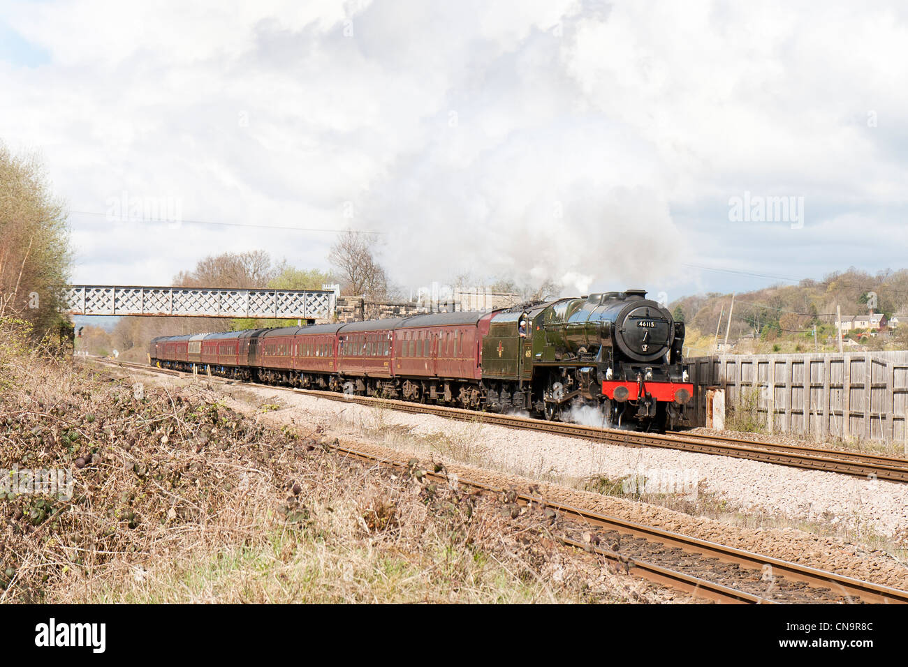 A steam locomotive pulling a passenger train on the mainline near Mirfield, West Yorkshire Stock Photo