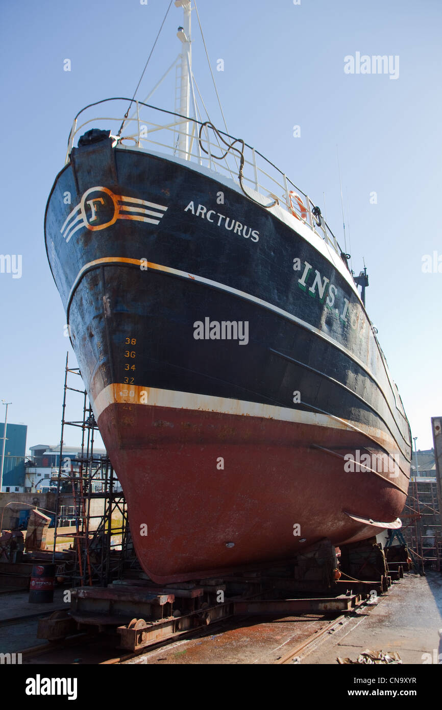 Trawler on the slipways, in repair yards at Peterhead Harbour Scotland UK Stock Photo
