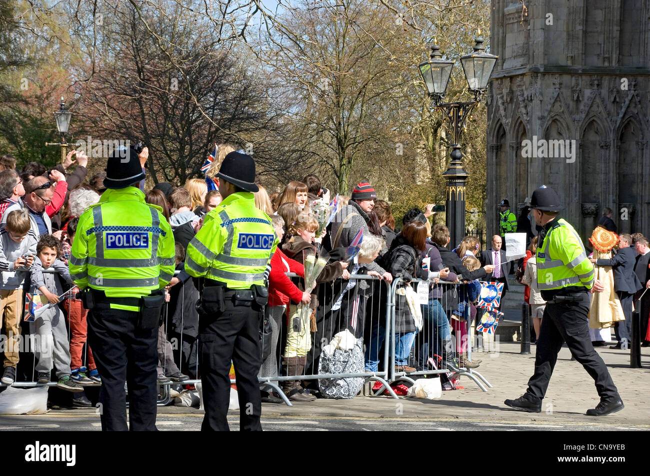 Crowds People visitors waiting to greet the Queen outside West Front of York Minster North Yorkshire England UK United Kingdom GB Great Britain Stock Photo