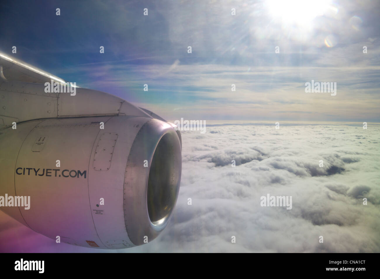 Cityjet aircraft on flight above clouds Stock Photo