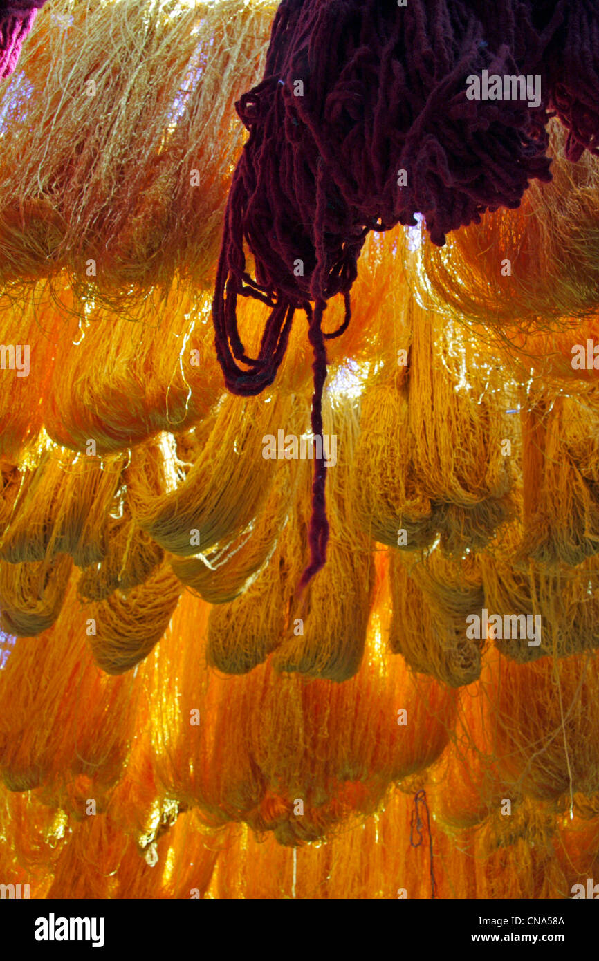 Sheaves/hanks/skeins freshly dyed yellow wool hang drying in the Wool Dyers souk/Souq  Marrakech, Morocco, Stock Photo