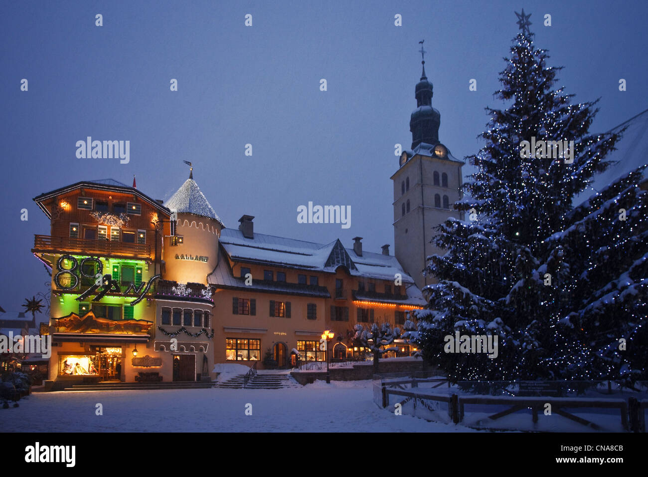 France, Haute Savoie, Megeve, La Maison Allard and the Christmas tree decorated with Swarovski on Church Square Stock Photo