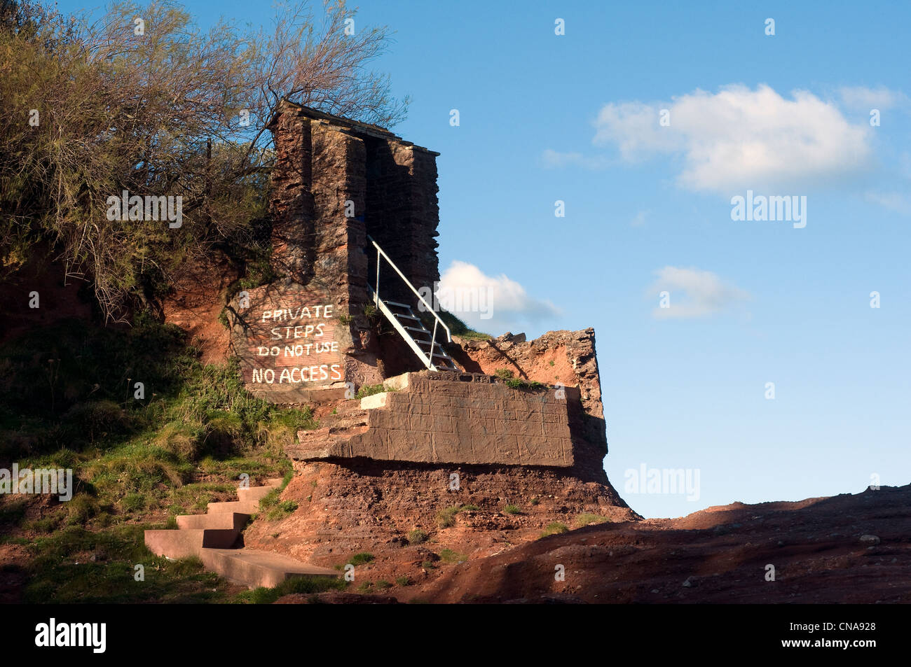 private steps,no access,Narnia ,Steps and Door on exposed rocks on Devon coast,Caves,Rocks, rock formation,Seaguls and Torbay Stock Photo