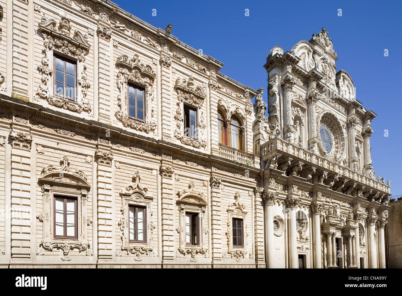 Italy, Puglia, Lecce, Palazzo del Governo in old Celestine convent from 17th century with Santa Croce basilica (16th adn 17th Stock Photo