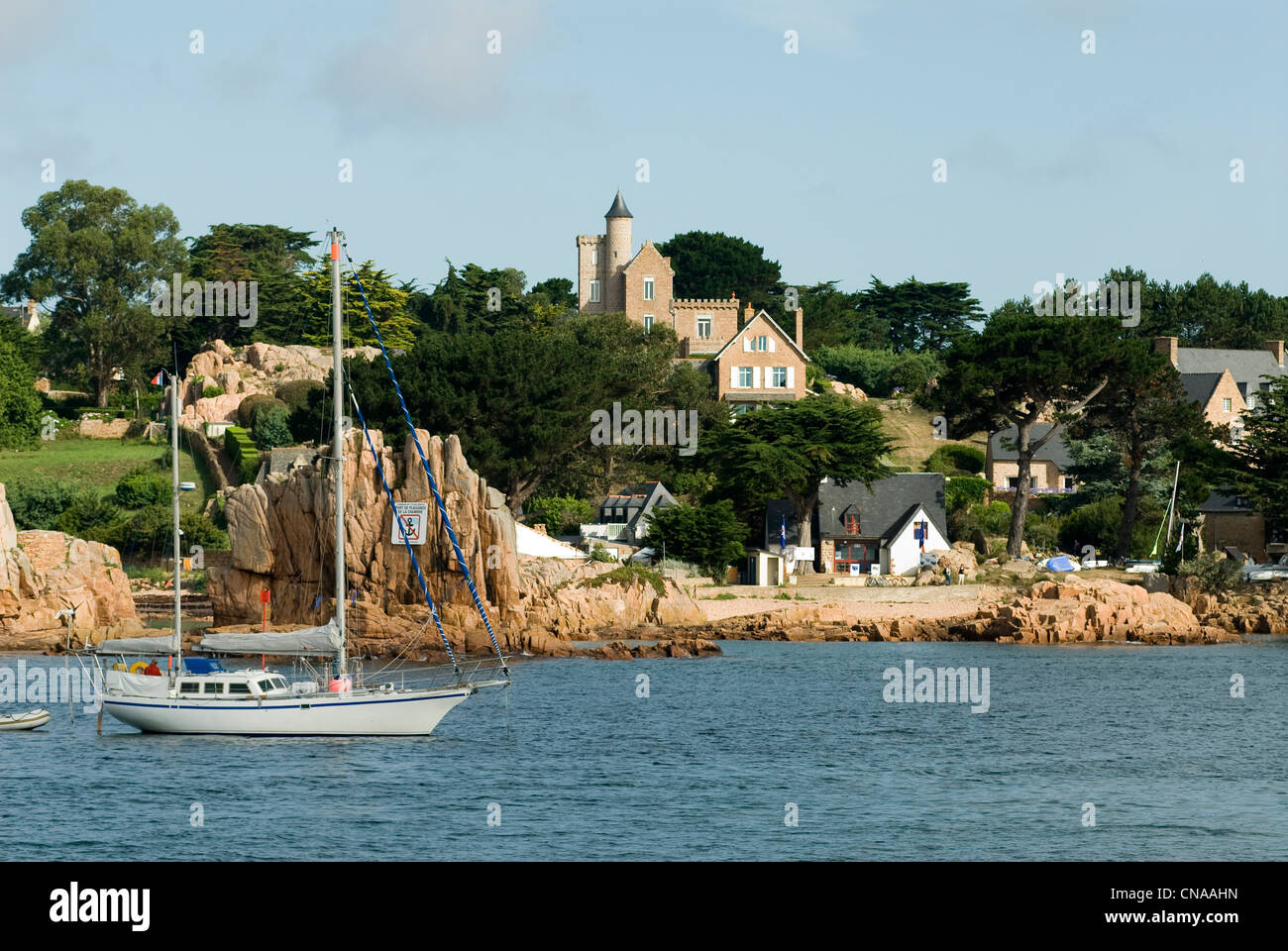 France, Cotes d'Armor, Brehat island, boat anchored off the beach of Rosedo Stock Photo