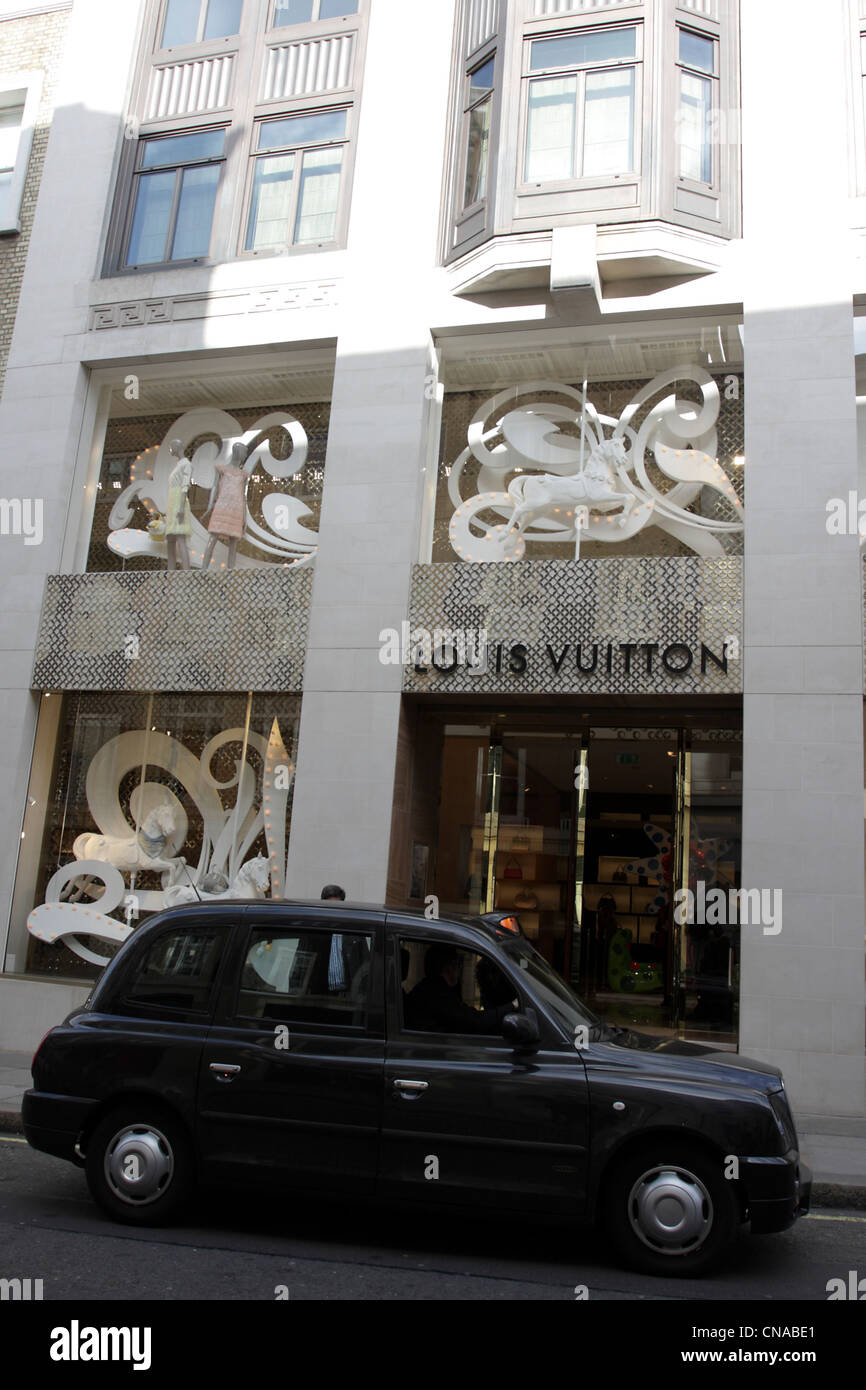 United Kingdom, London, Mayfair, New Bond Street, Louis Vuitton flagship  store open in 2010, Stock Photo, Picture And Rights Managed Image. Pic.  HMS-HEM544796