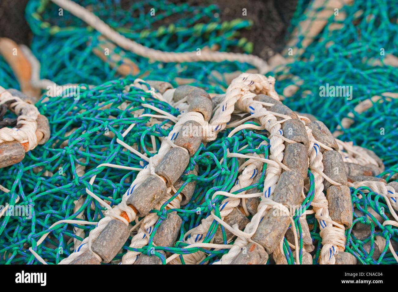 Pacific herring purse seine net and lead line on stack on fishing boat in Sitka, Alaska. Stock Photo