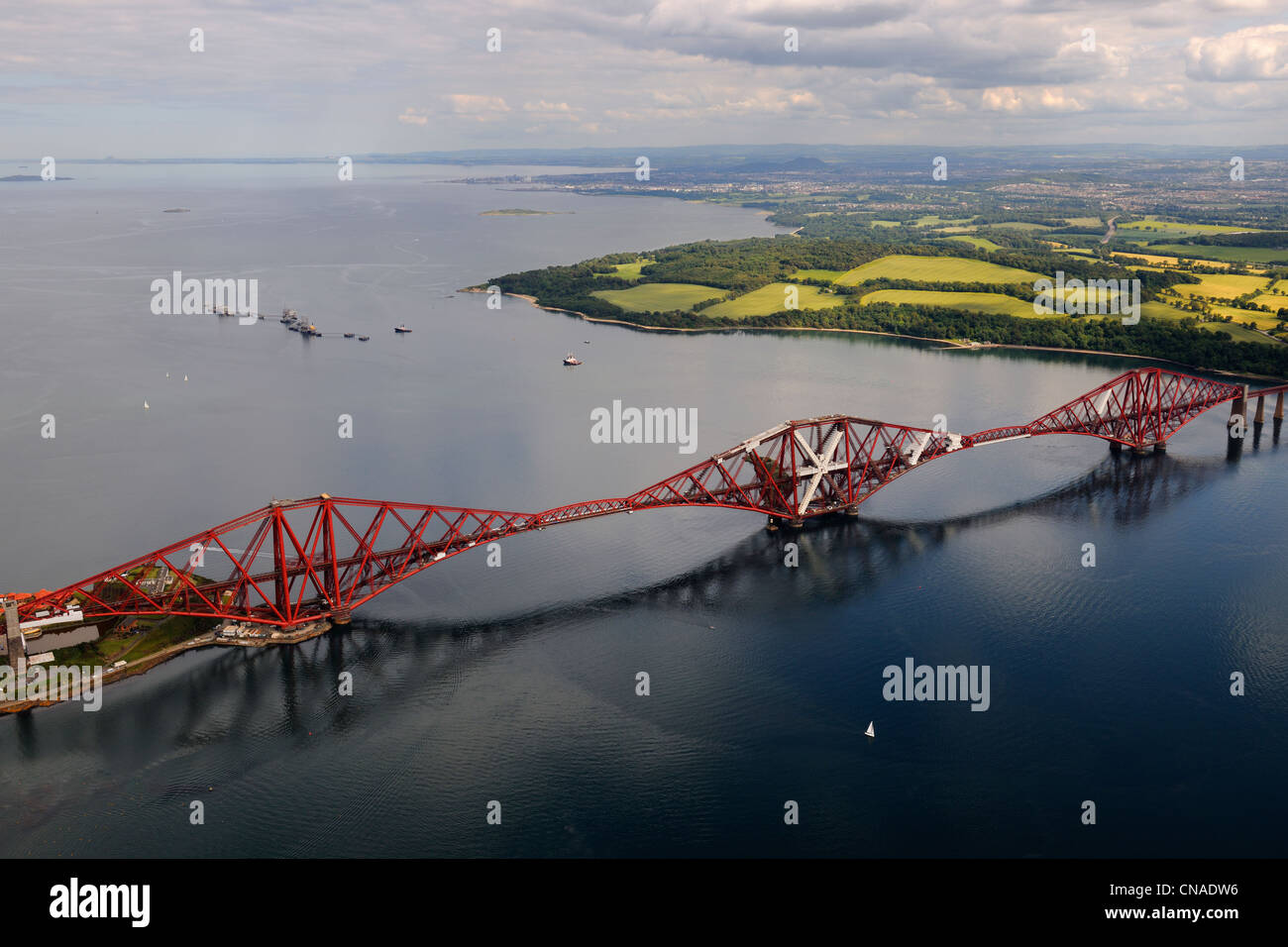United Kingdom, Scotland, Firth of Forth, the Forth Railway Bridge and Edinburgh in the background (aerial view) Stock Photo