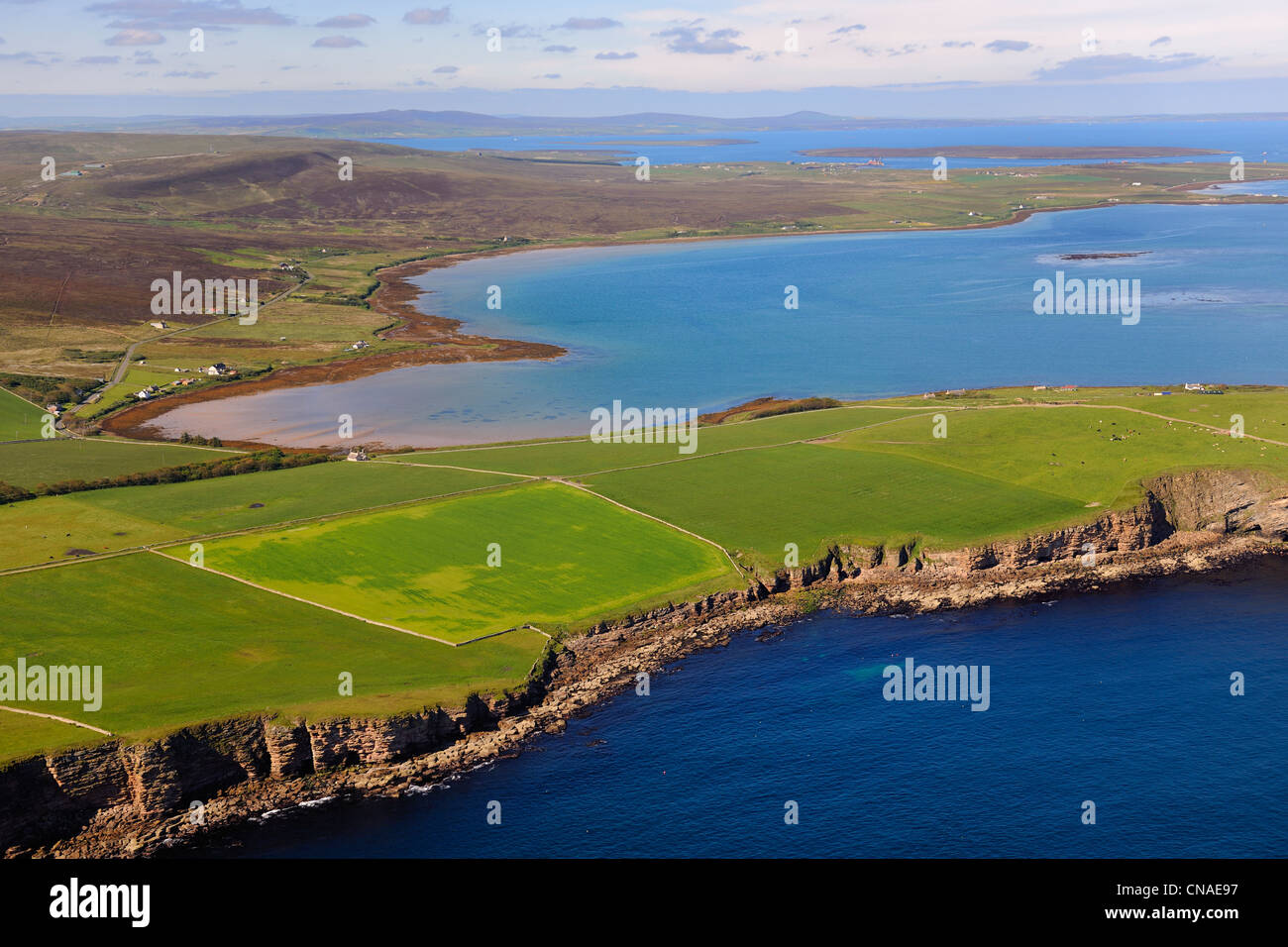 United Kingdom, Scotland, Orkney Islands, fields and scattered farms on the south of the Isle of Hoy in front of Scapa Flow Stock Photo