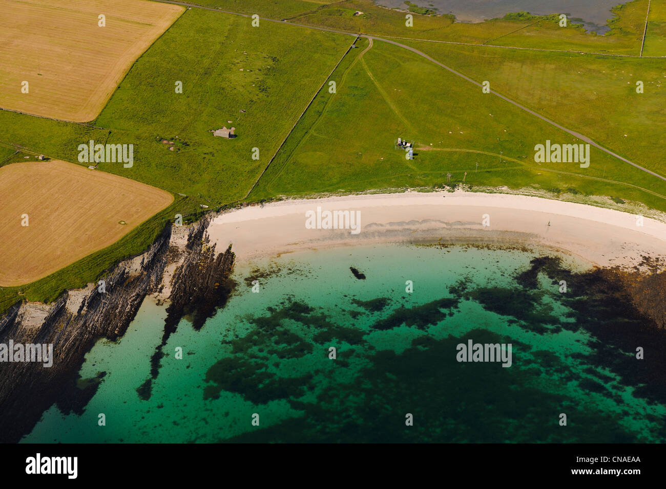 United Kingdom, Scotland, Orkney Islands, Papa Westray Island, beach and clear sea (aerial view) Stock Photo