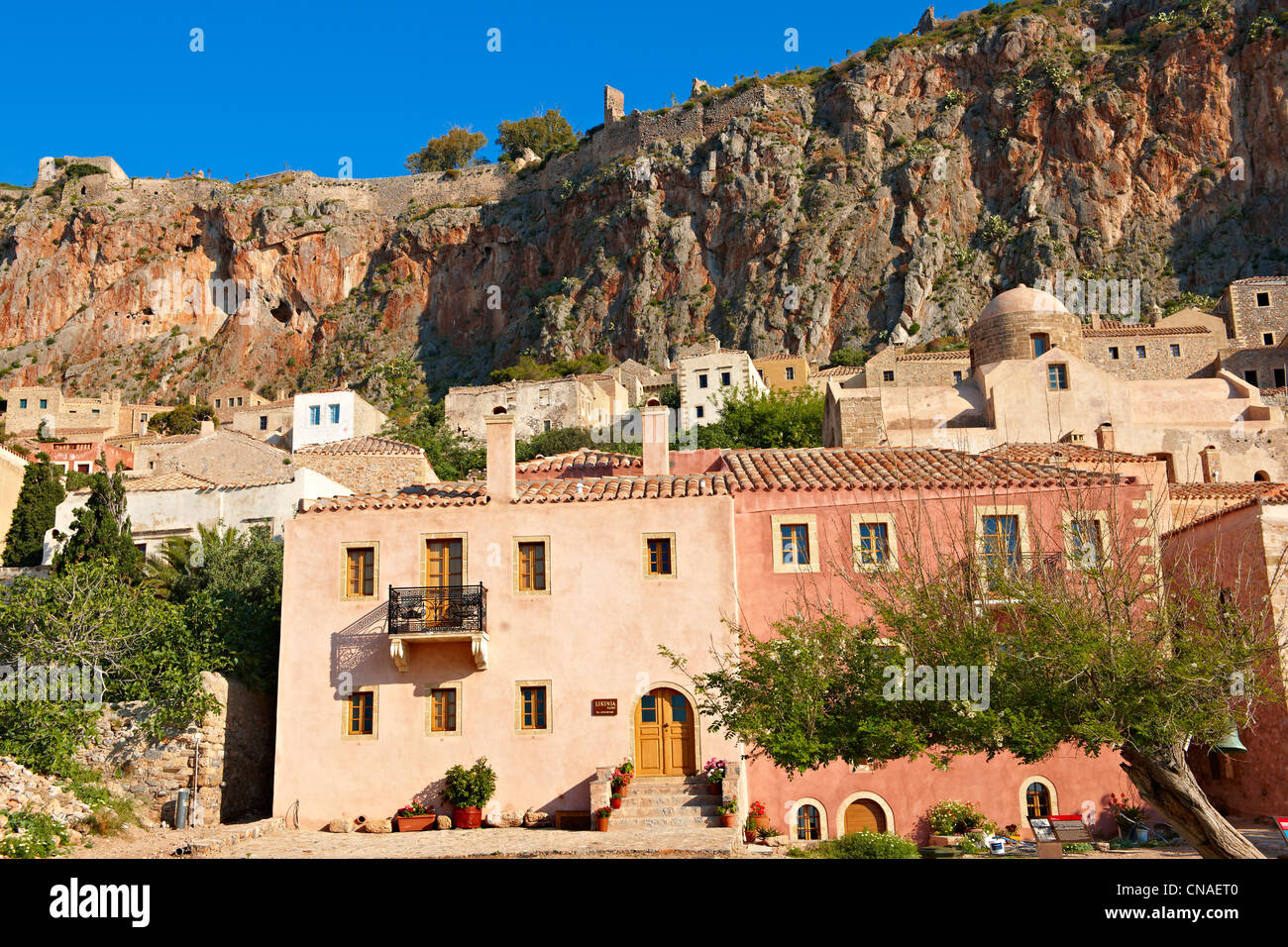 Houses of Monemvasia ( Μονεμβασία ) Byzantine Island castle town with acropolis on the plateau. Peloponnese, Greece Stock Photo