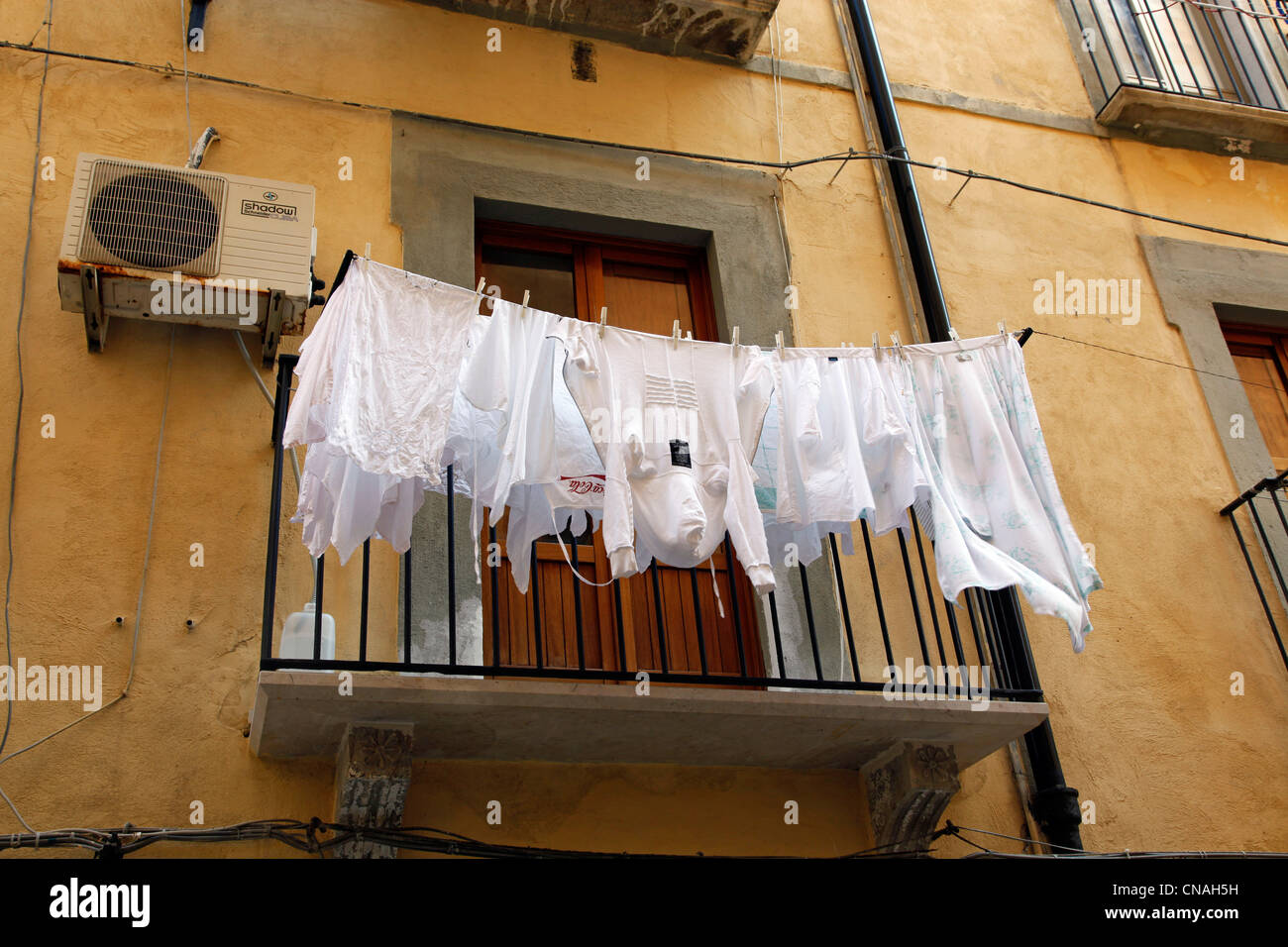 Washing hanging out in the street in Trapani, Sicily, Italy Stock Photo