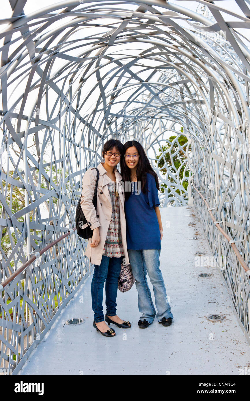 Two attractive young local Taiwanese women on Rippling Moonlit Talk Bridge, Chiayi, Taiwan. JMH5958 Stock Photo