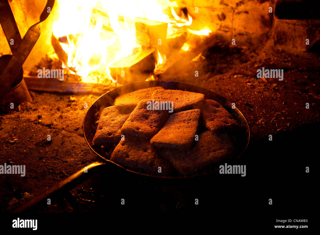Finland, Lapland province, Urho Kekkonen National Park, Saariselka, reindeer with bread, cooking on wood fire Stock Photo