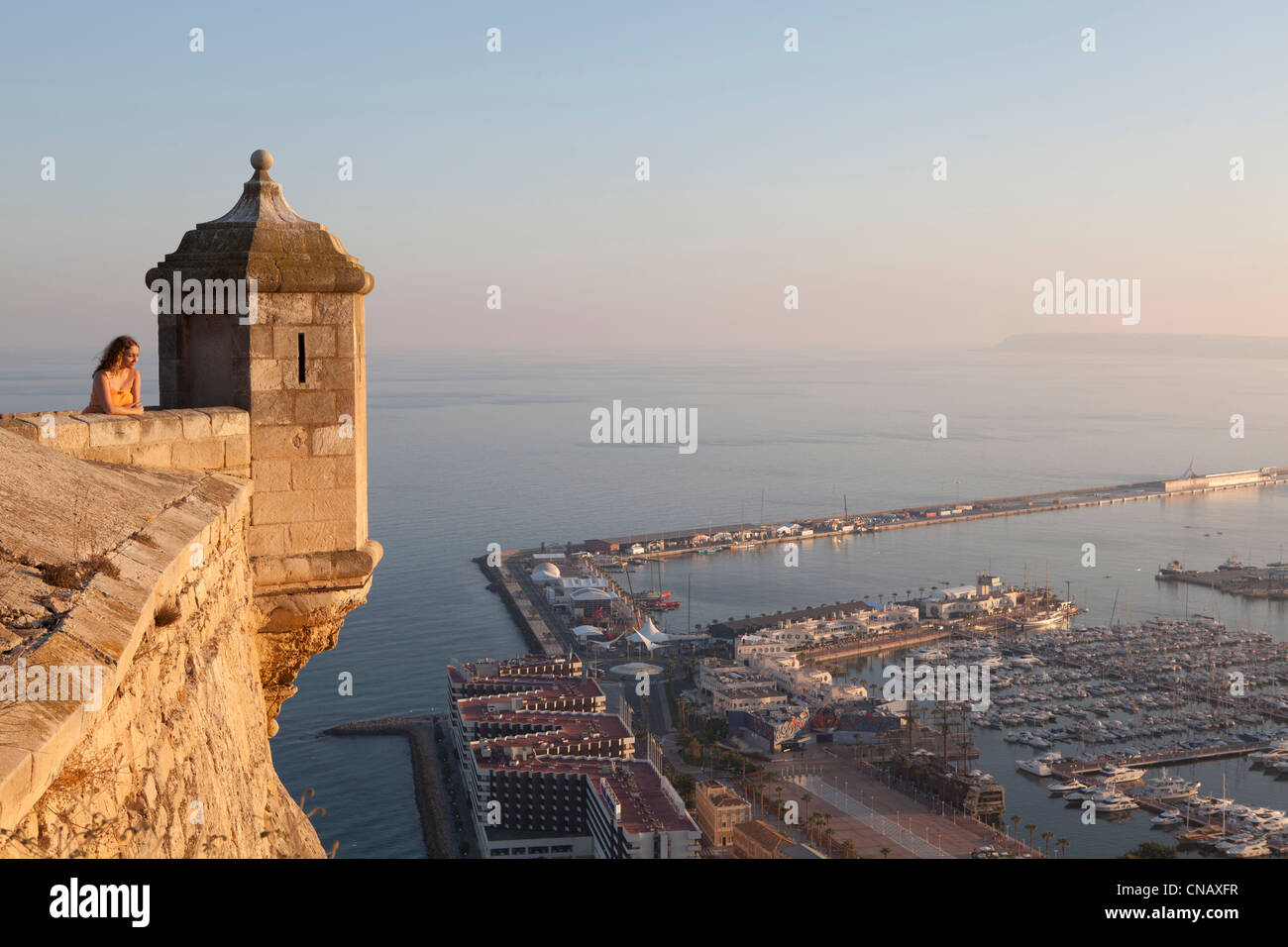 Woman admiring view from castle Stock Photo - Alamy
