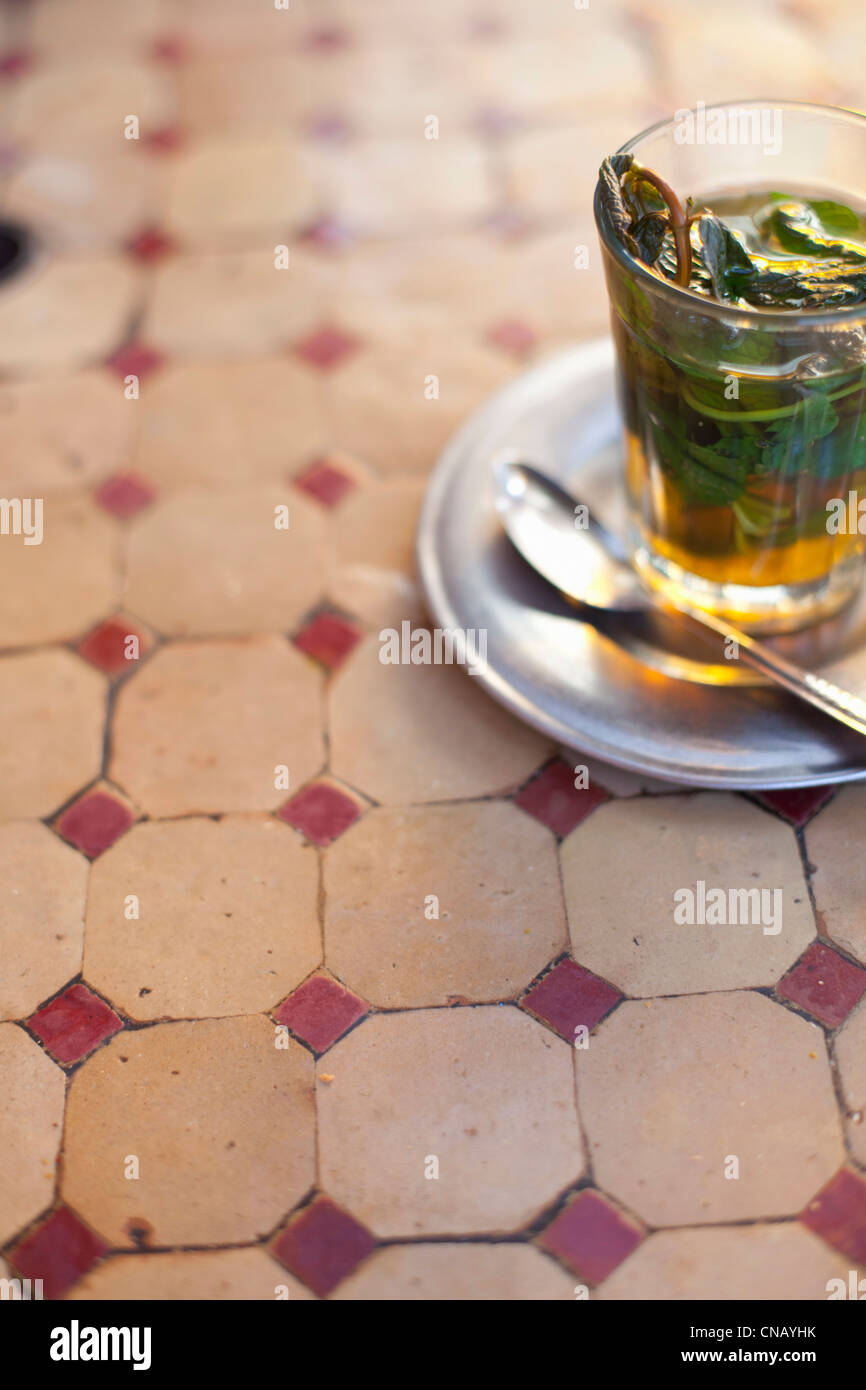 Glass of mint tea on restaurant table Stock Photo