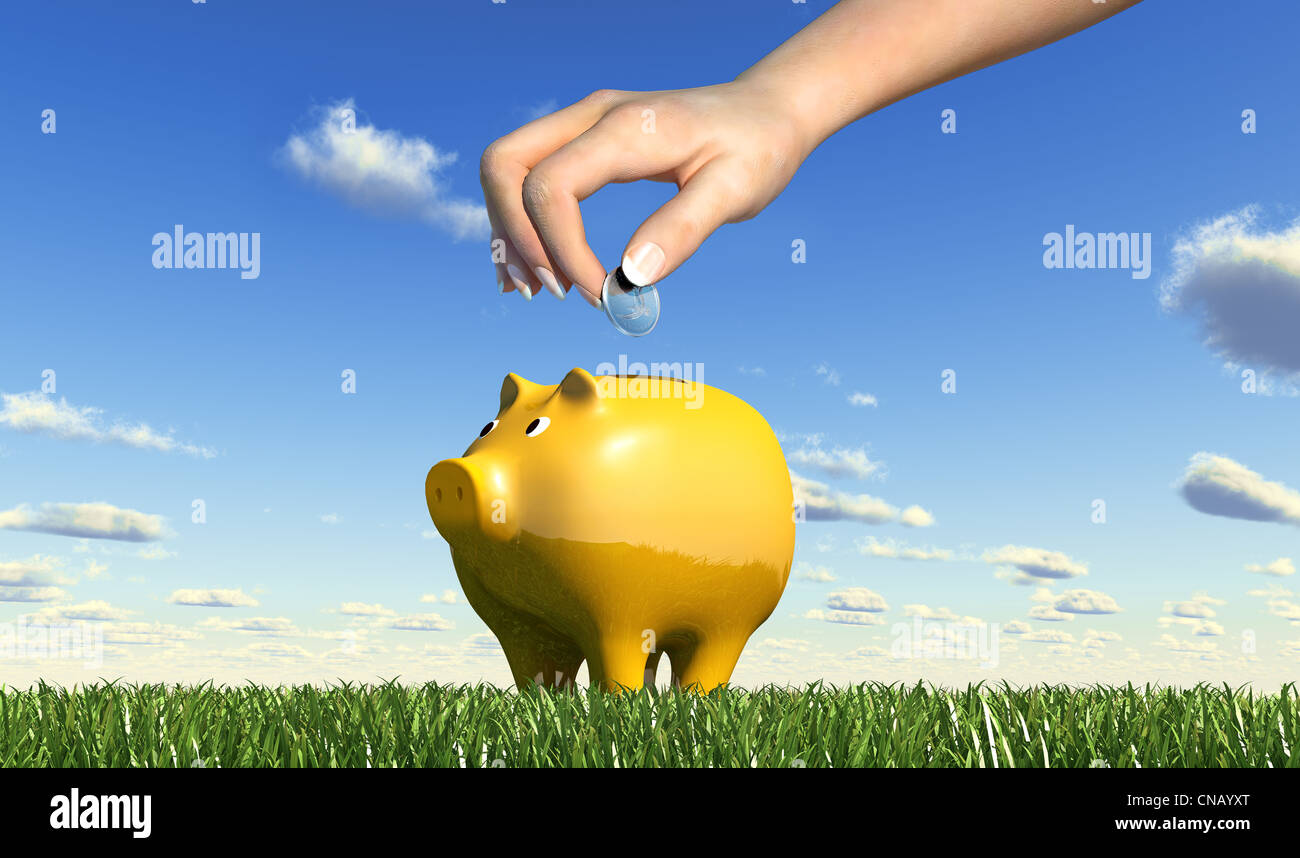 Woman hand inserting a coin into a yellow ceramic piggy bank placed on ...
