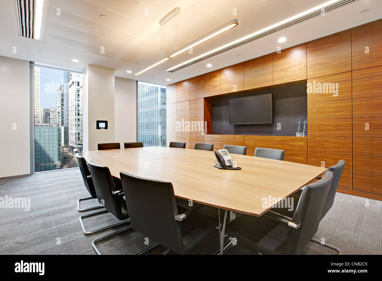 board room meeting room large table screen chairs Stock Photo