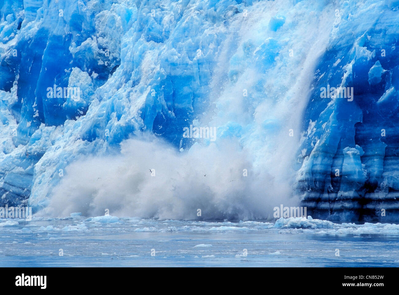 Close up of Hubbard Glacier calving into Disenchantment Bay, Yakutat, Southeast Alaska, Summer Stock Photo