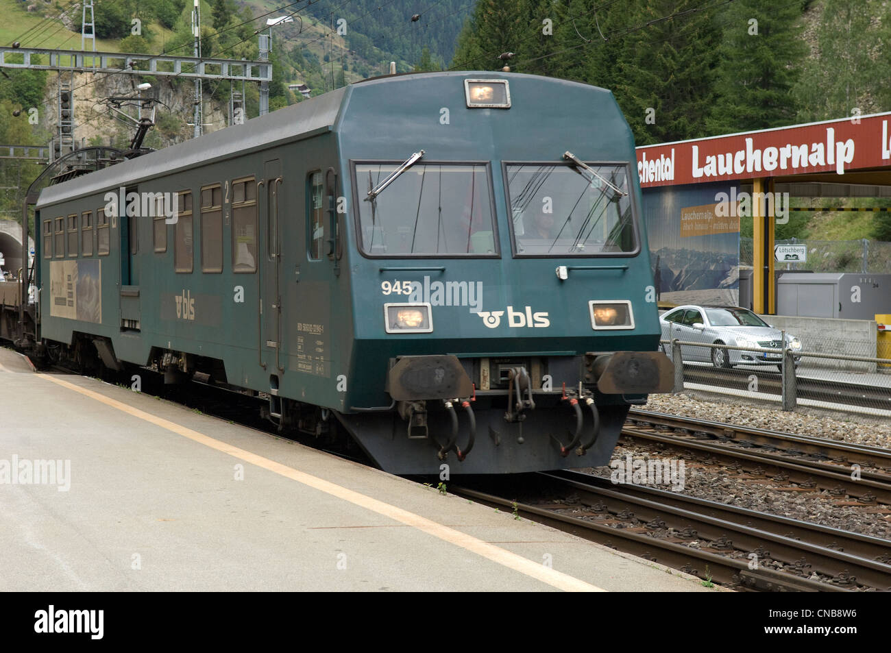 Car transport train in Goppenstein station in Canton of Valais in Switzerland. This carries Car transport train in Goppenstein station in Canton of Valais in Switzerland. This carries