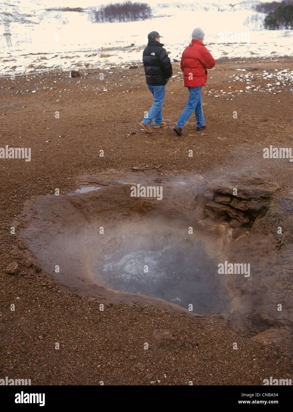 Iceland Geysir Blue coloured hot spring steaming in the cold Stock Photo