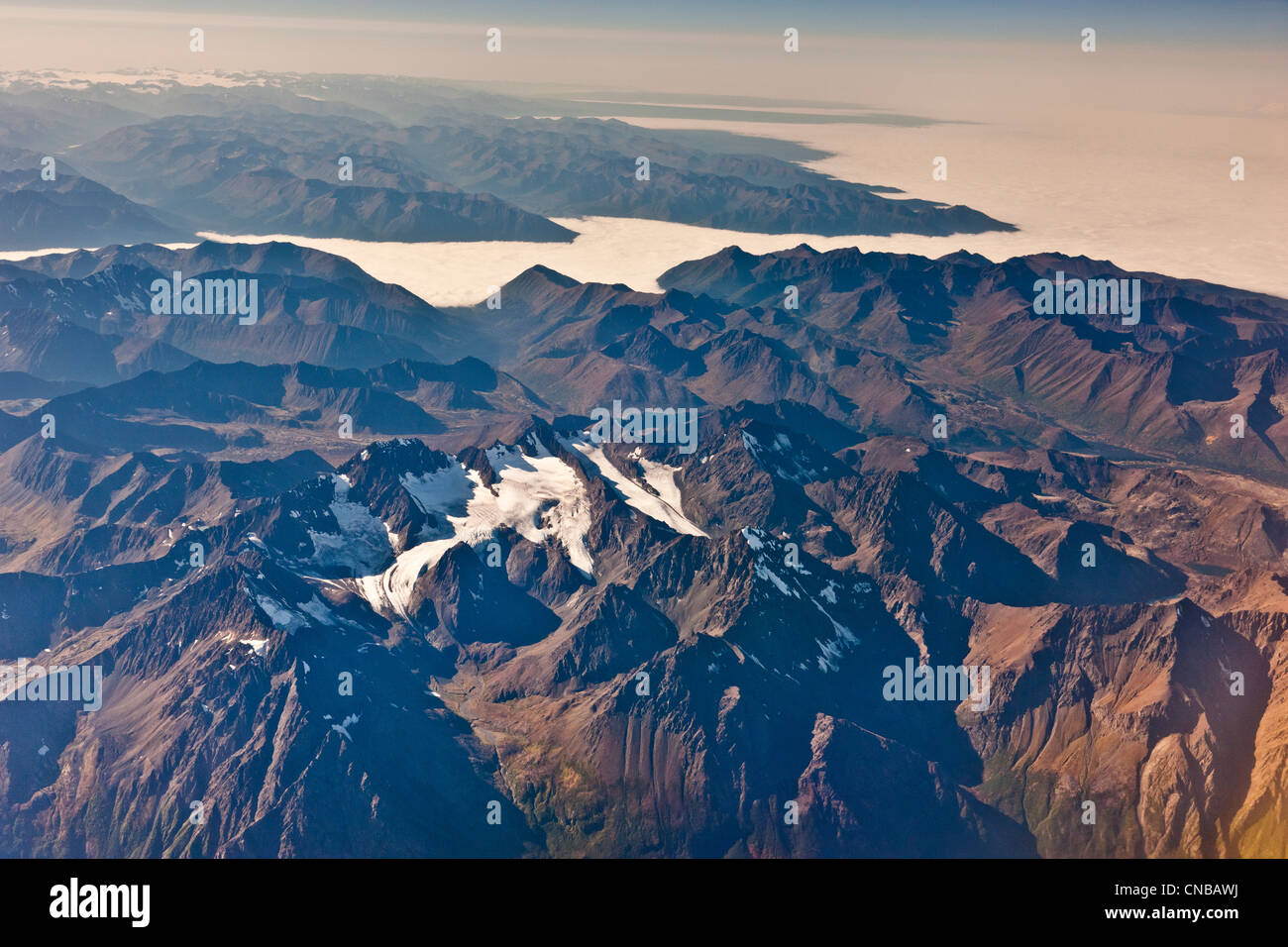 Aerial view of the Chugach Mountains and fog covering Cook Inlet and Turnagain Arm, Southcentral Alaska, Autumn Stock Photo