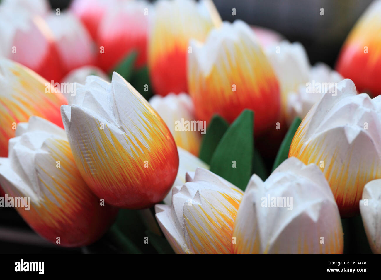 Image of colorful wooden tulips on a market stand in Amsterdam. Stock Photo