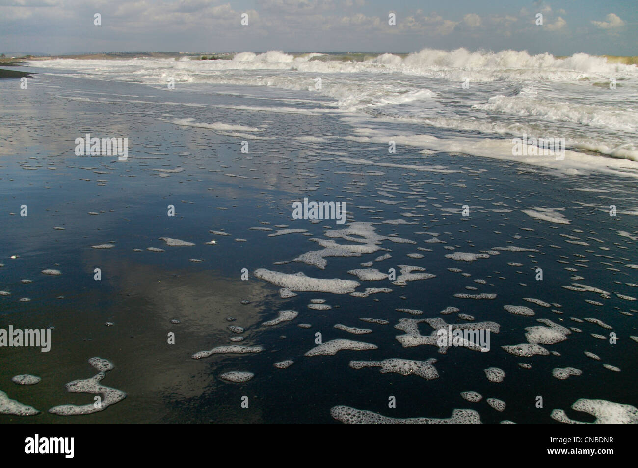 Waves on sandy shore black hi-res stock photography and images - Alamy