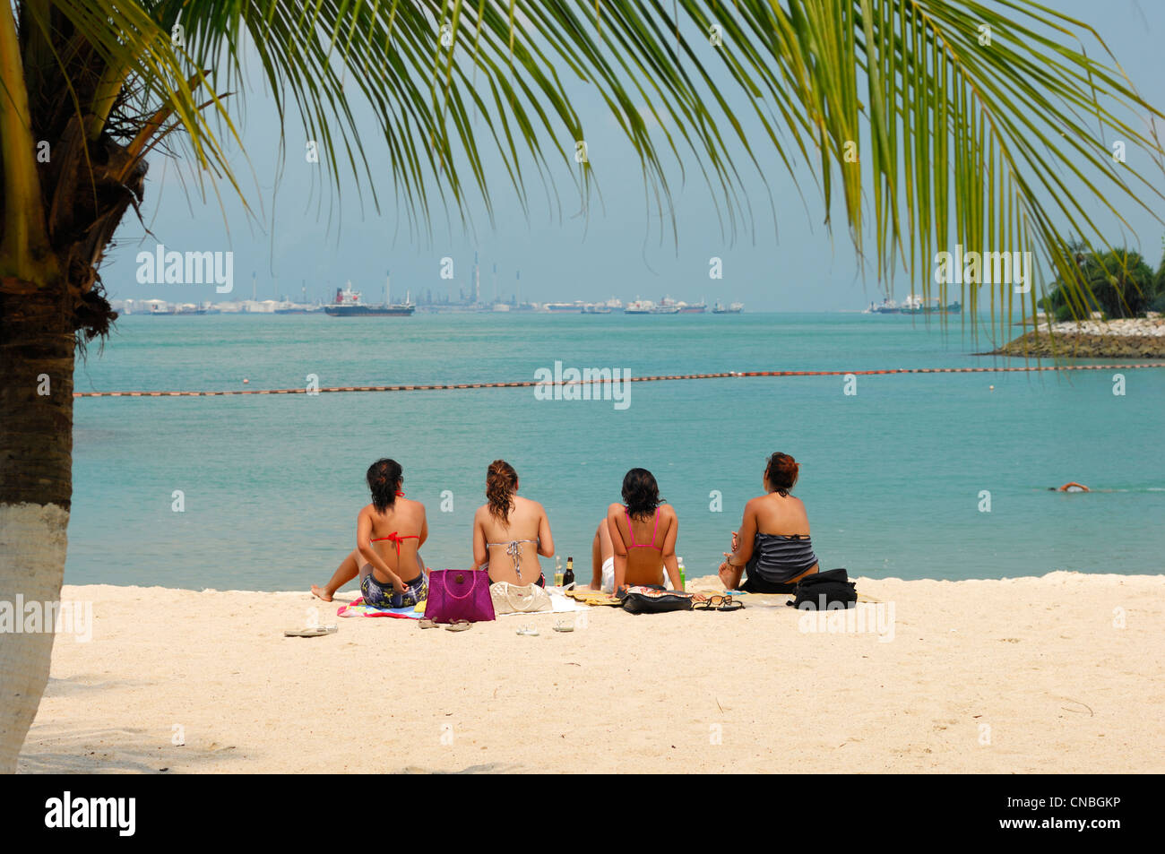 Singapore, Sentosa island, tourists on the artificial beach of Sentosa