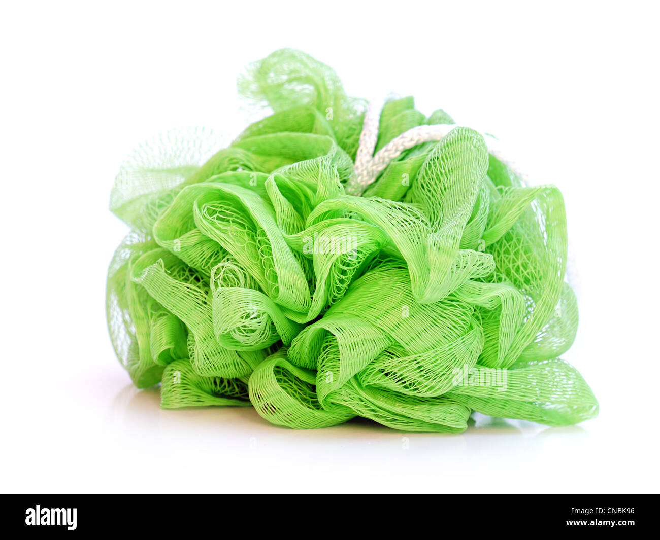 Green nylon bath washcloth on white background Stock Photo
