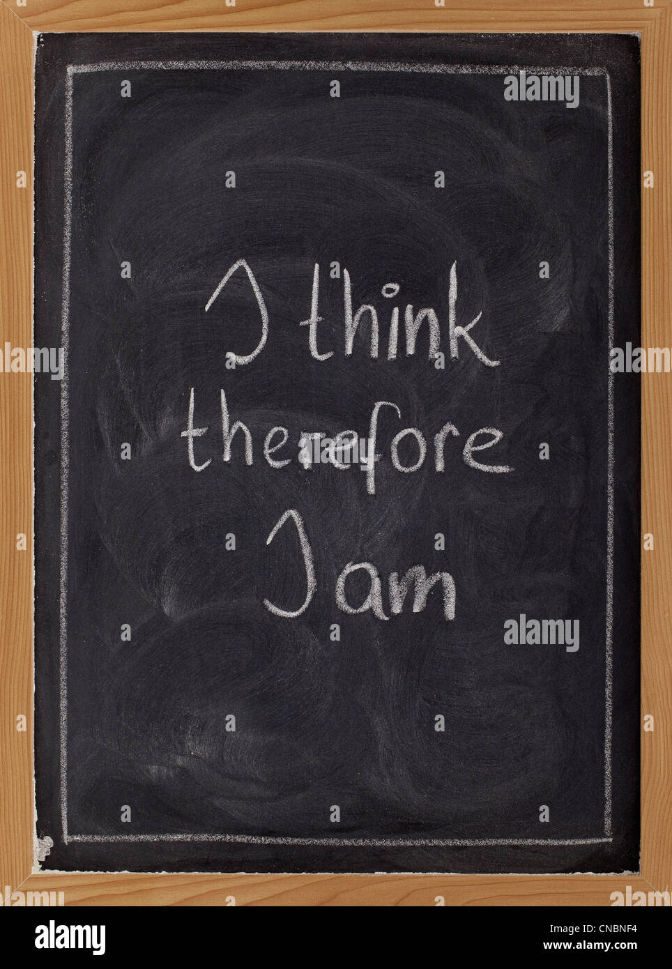 I think, therefore I am - philosophical statement used by René Descartes; white chalk handwriting on blackboard Stock Photo