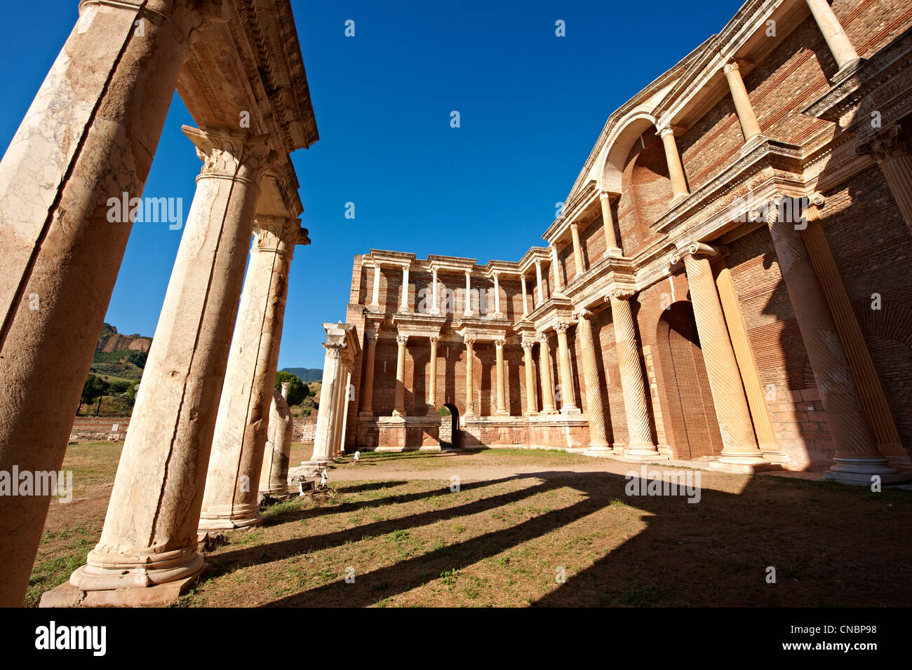 The Bath Gymnasium complex of Sardis, a typical example of the colonnaded palaestra front of a Hellenistic 1st cent. Turkey Stock Photo